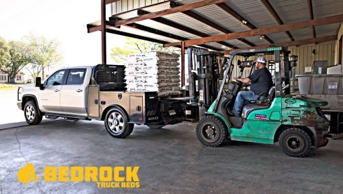 flatbed being loaded with forklift