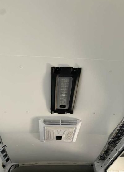black and white terminals on white van roof