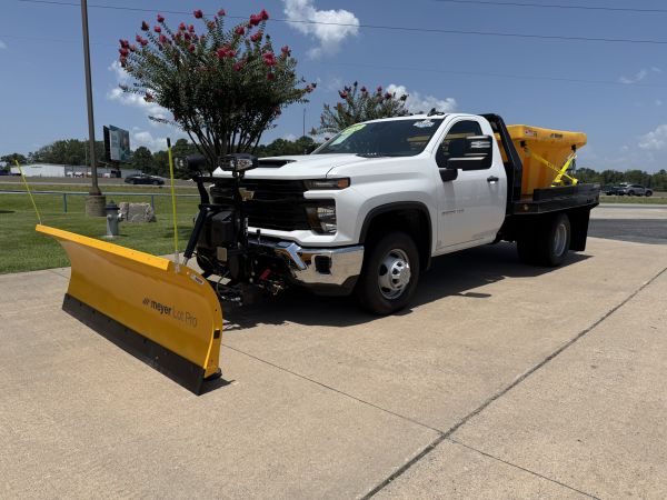 Side view of snow plow and salt spreader