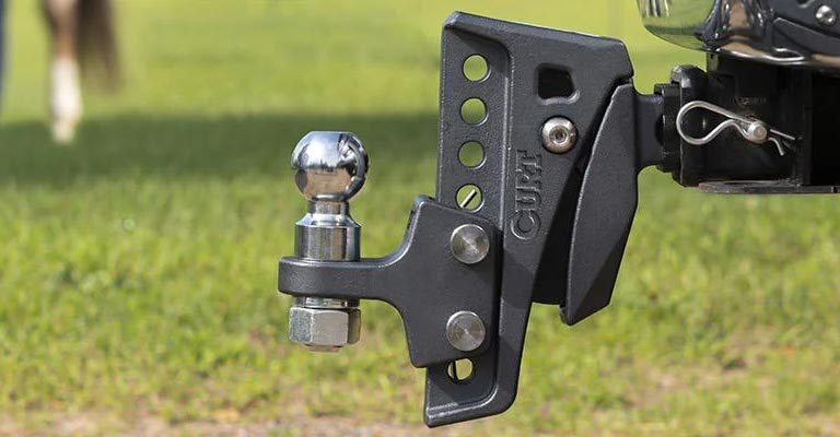 curt towing ball hitch installed on work vehicle