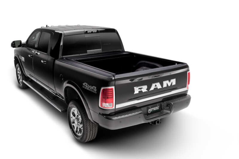 RETRAX OneMX Bed cover installed on work truck with it open to expose bed