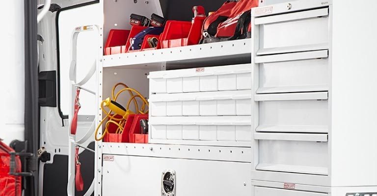 weather Guard heavy duty shelving full of tools in work van