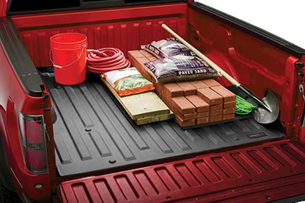 weather tech bed liner for work trucks covered with tools