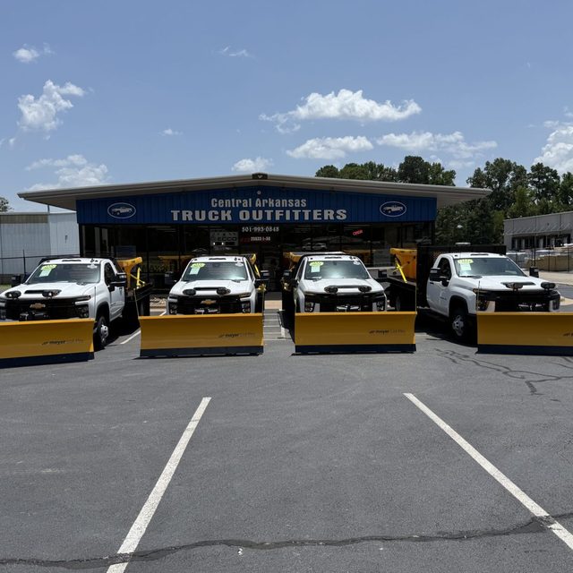 Fleet of work trucks fitted with Meyer snow plows at Central Arkansas Truck Outfitters in Bryant Arkansas