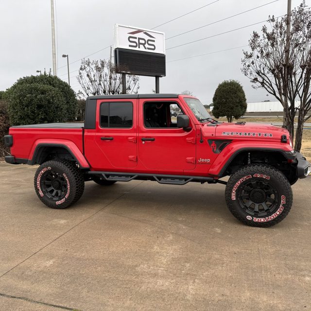 Lift kit installed on a red Jeep Gladiator at Central Arkansas Truck Outfitters in Bryant Arkansas