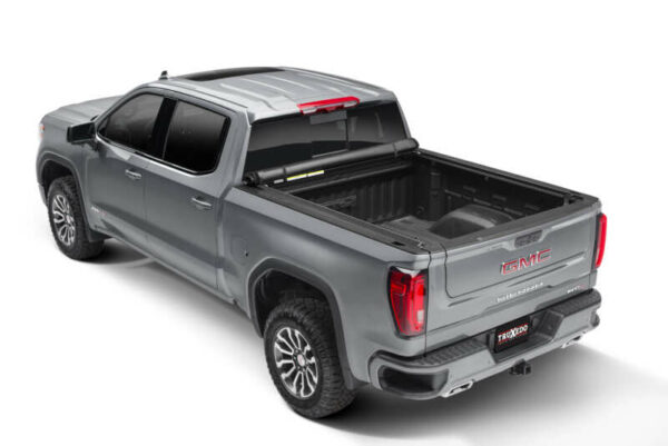 TruXedo TruXport Lo Pro tonneau cover installed on work truck and opened to access bed