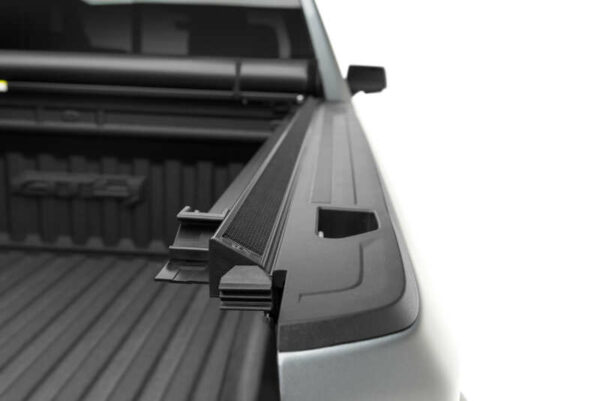 TruXedo TruXport Lo Pro tonneau cover installed on work truck and opened to show bed