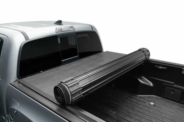 TruXedo Sentry tonneau cover installed on work truck and partially rolled up