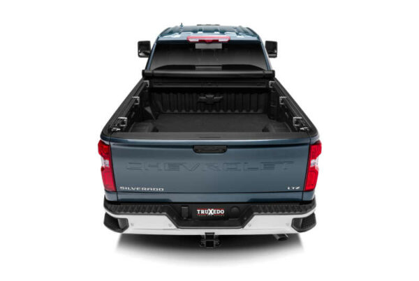 TruXedo TruXport tonneau cover installed on work truck and opened to show bed