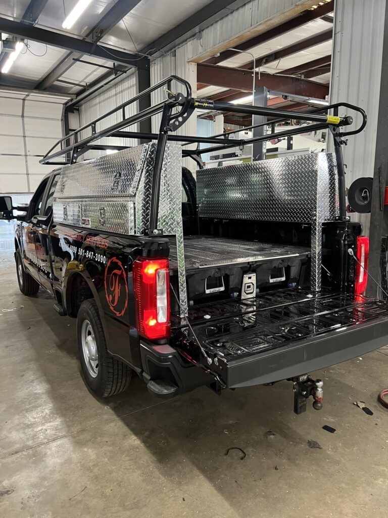 Work Truck with new toolboxes and a ladder rack installed along with sliding drawers on the bottom of bed