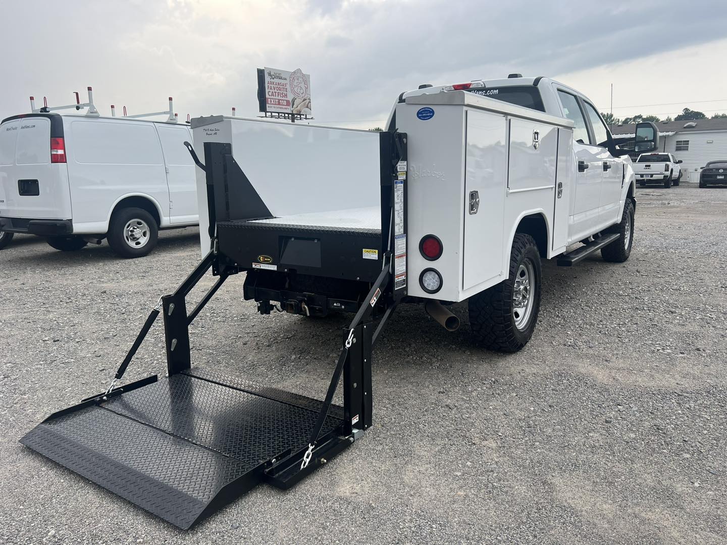 work truck with newly installed liftgate lowered to ground