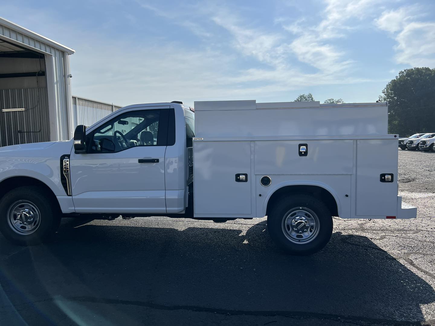 work truck with newly installed utility bed with many doors for storage compartments