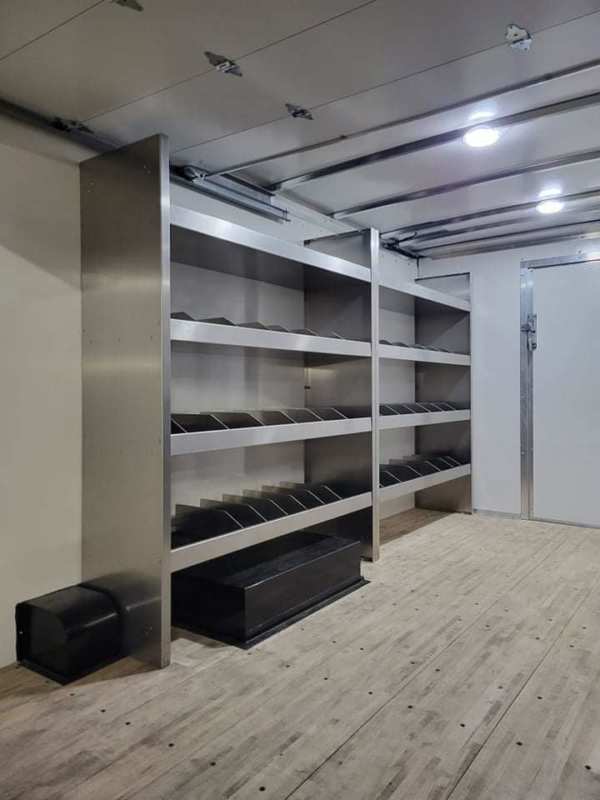 large sectioned shelves installed in box truck