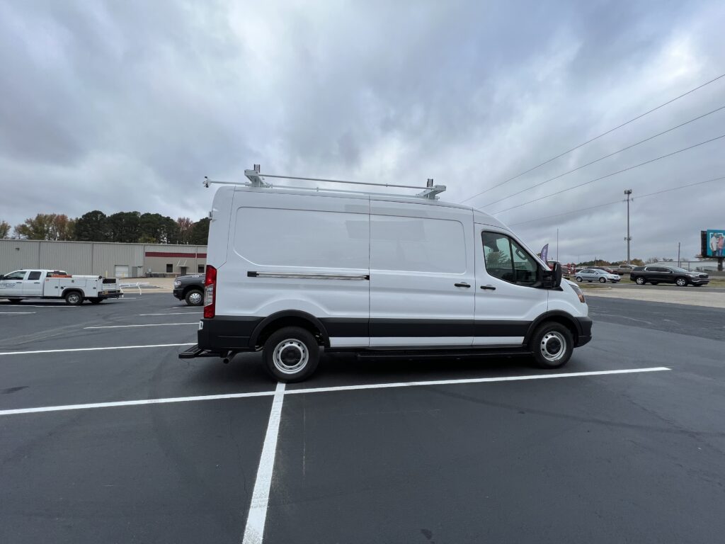 white work van with roof rack attached