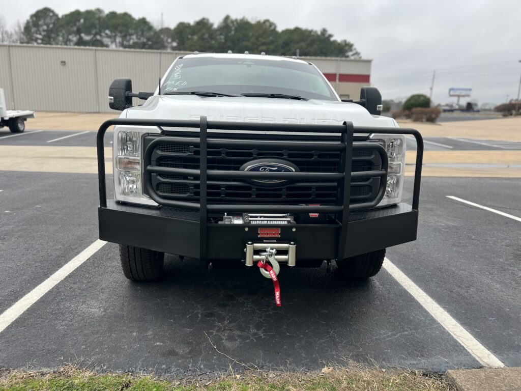 brush guard and winch installed on front of ford work truck